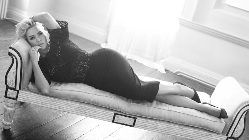 woman in black dress on chaise lounge