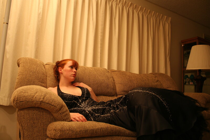 woman in black dress on couch