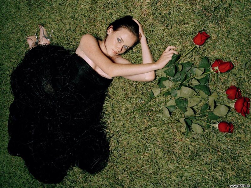 Woman in black dress on grass