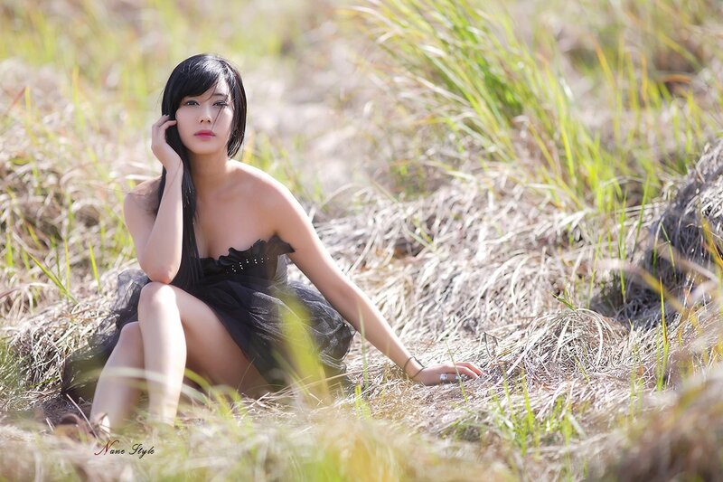 woman in black dress on grass