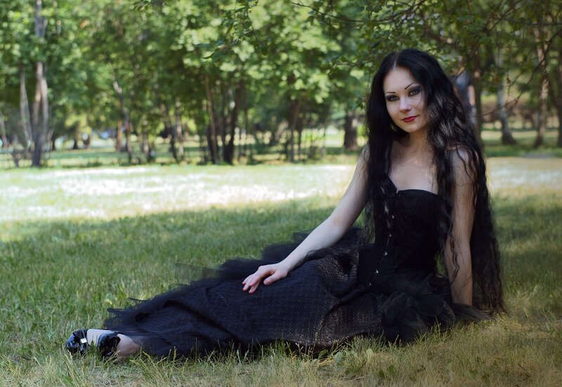 Woman in black dress on grass