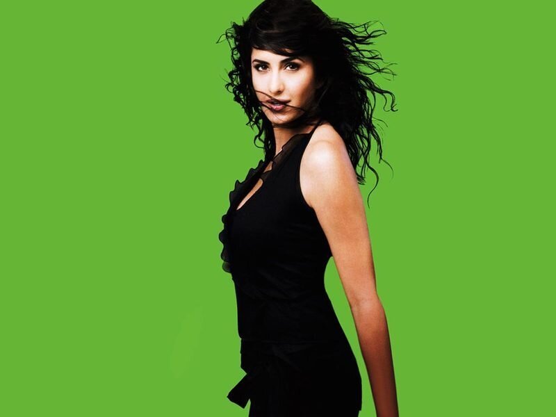 woman in black dress on green
