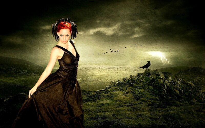 woman in black dress on hillside