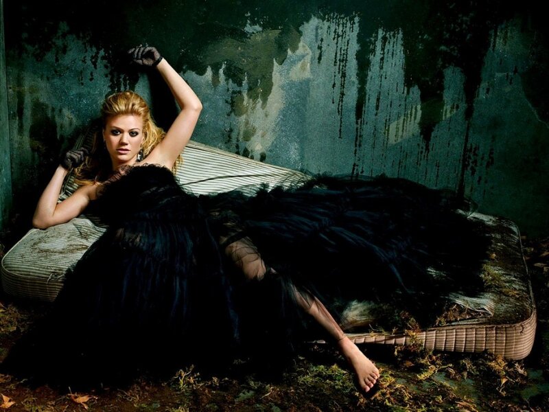 woman in black dress on mattress