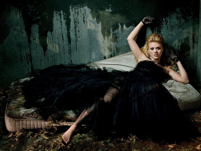 woman in black dress on mattress