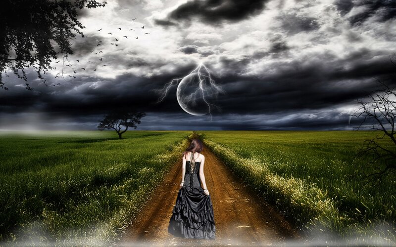 woman in black dress on path