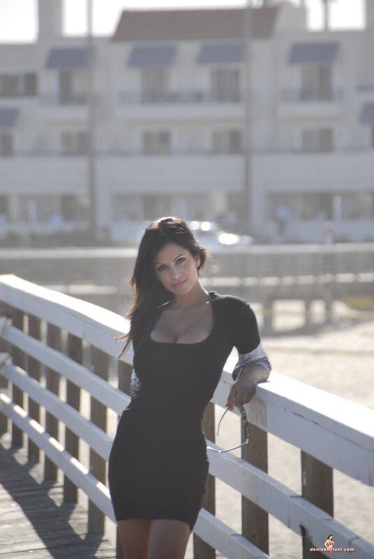 woman in black dress on pier
