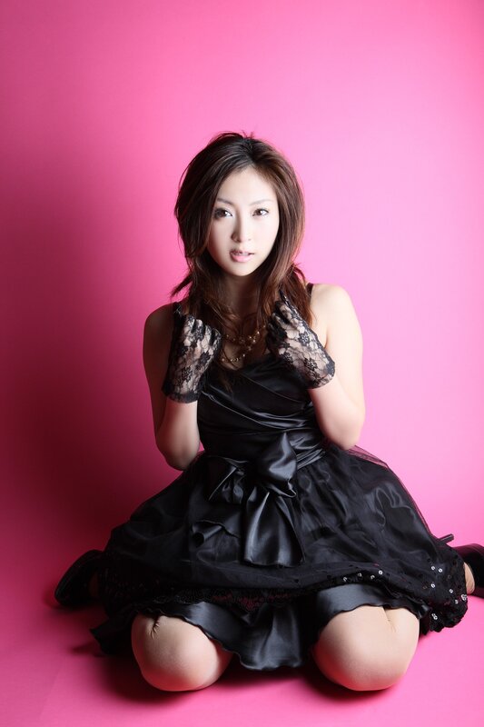 woman in black dress on pink