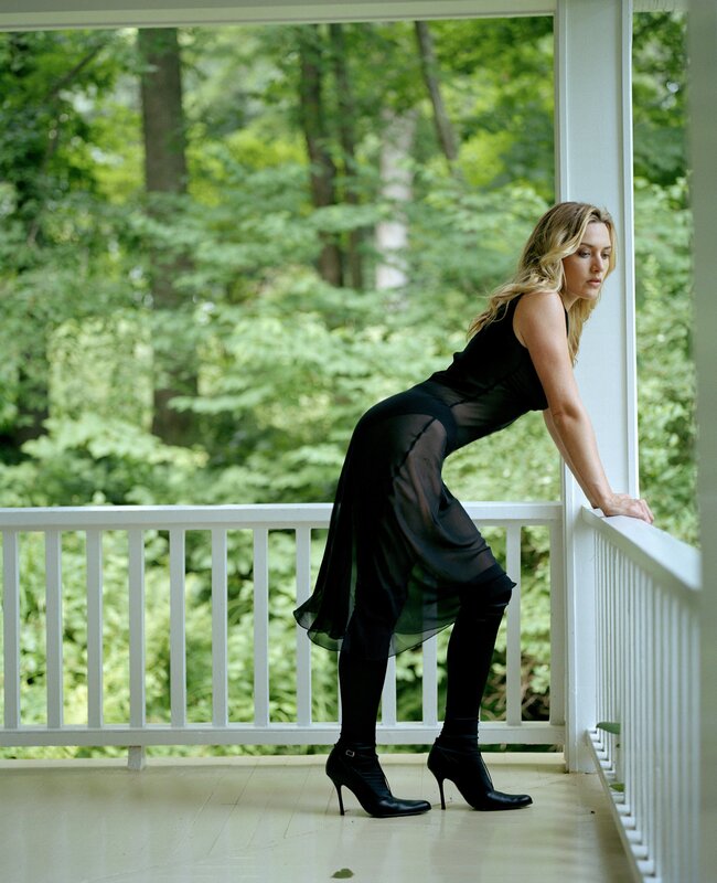 woman in black dress on porch