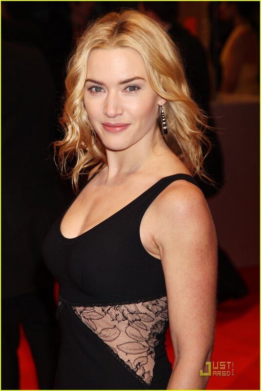 woman in black dress on red carpet