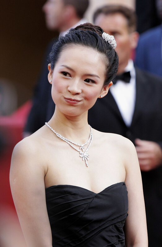 woman in black dress on red carpet