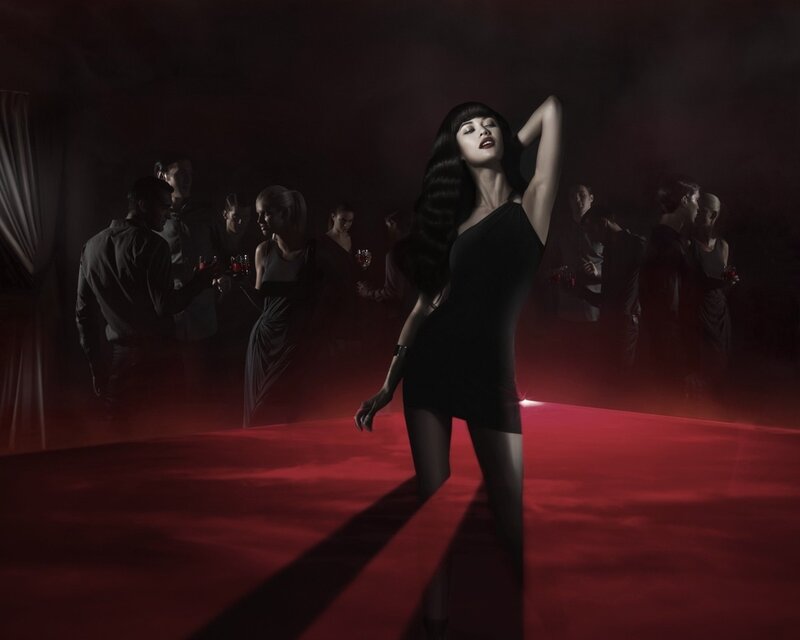 woman in black dress on red carpet