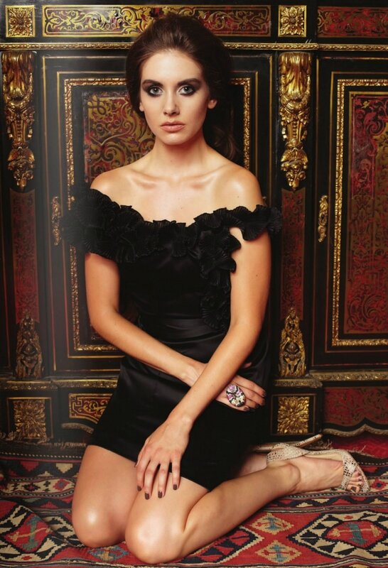 woman in black dress on rug