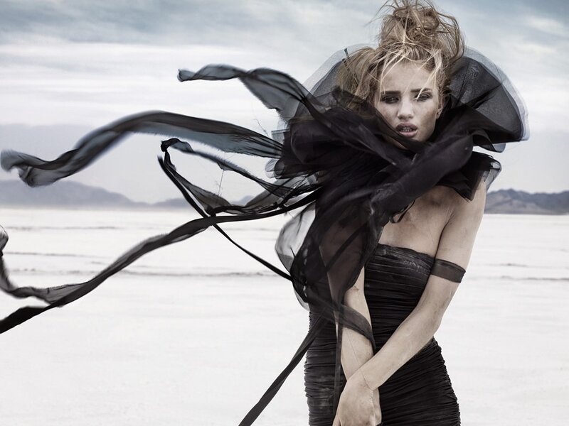 woman in black dress on salt flat