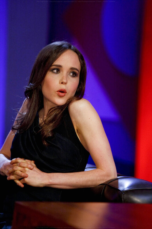 woman in black dress on stage
