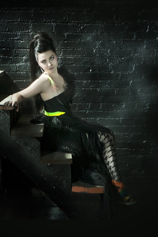 woman in black dress on stairs
