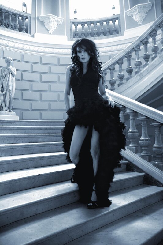 Woman in black dress on stairs