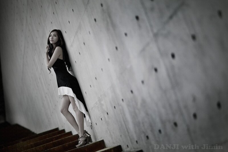 woman in black dress on stairs