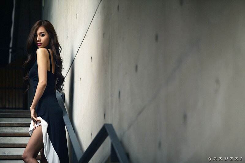 woman in black dress on stairs