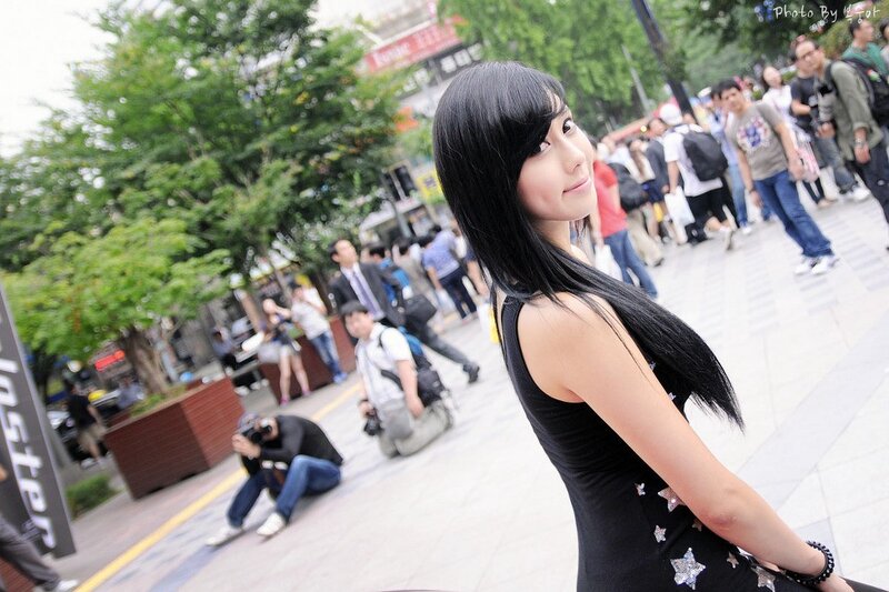 woman in black dress on street