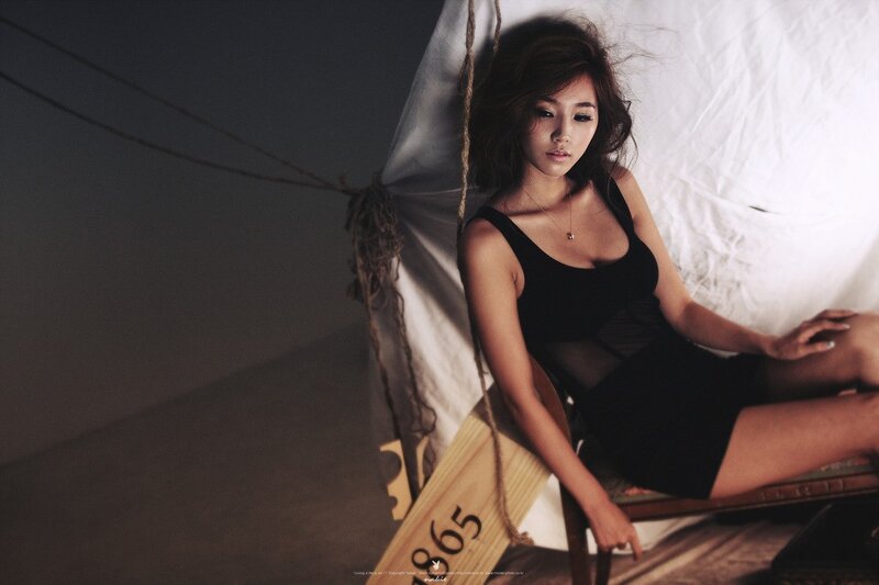 woman in black dress on swing