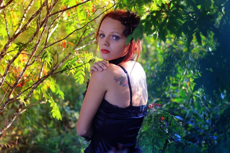 Woman in black dress outdoors