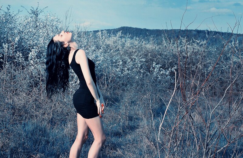 woman in black dress outdoors
