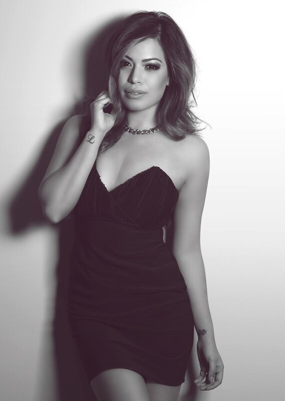 woman in black dress posing