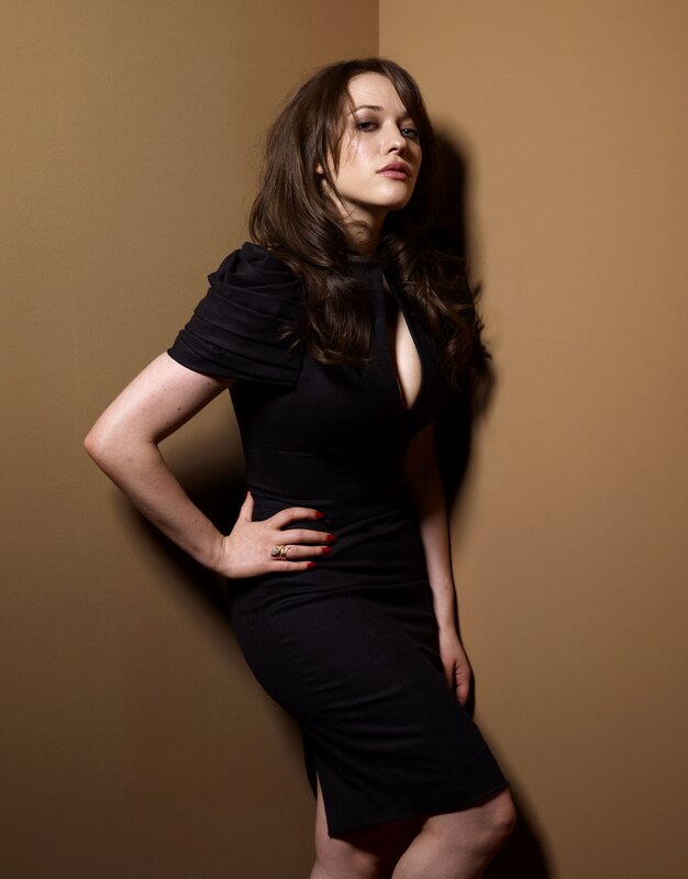 woman in black dress posing