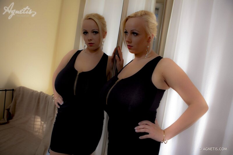 woman in black dress posing