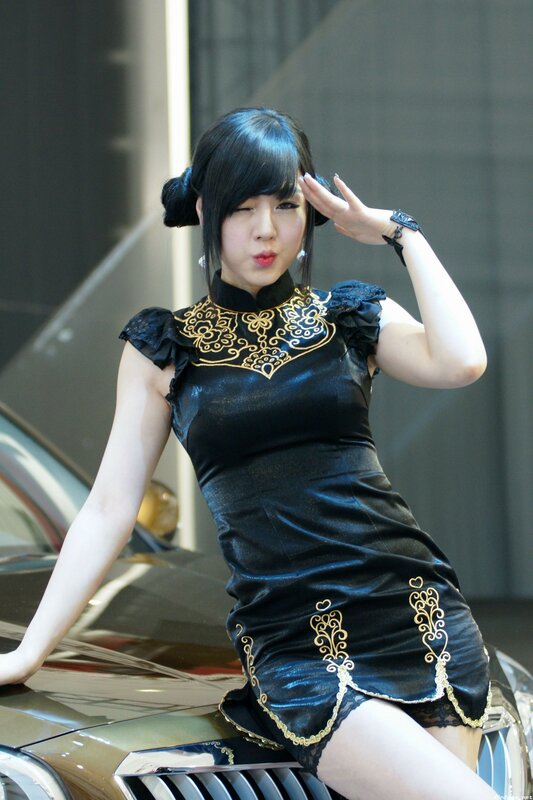 woman in black dress posing
