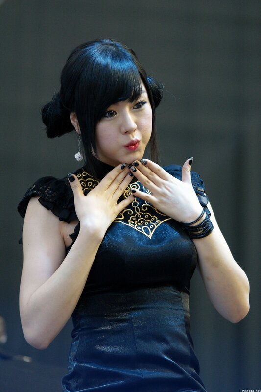 woman in black dress posing