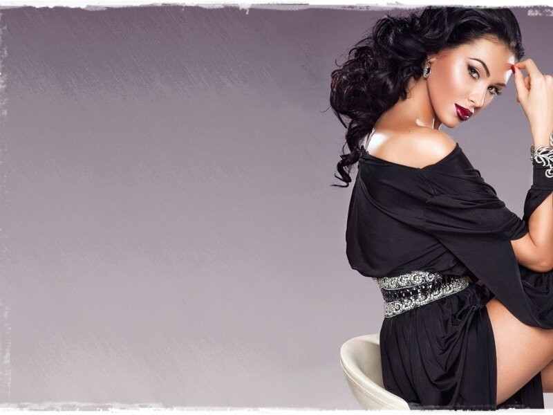woman in black dress posing