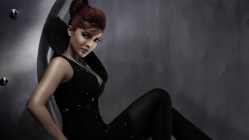 woman in black dress posing
