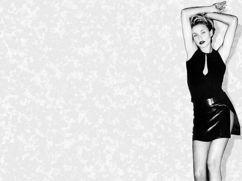 woman in black dress posing