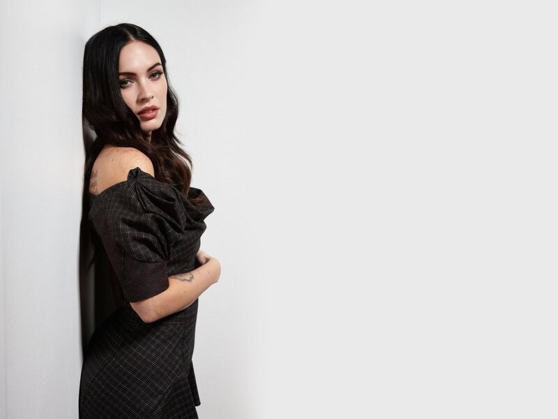 woman in black dress posing