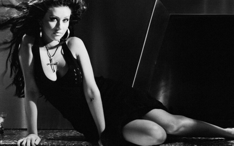 woman in black dress posing