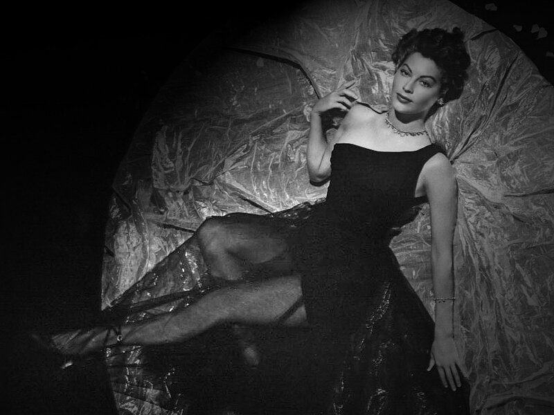 woman in black dress posing