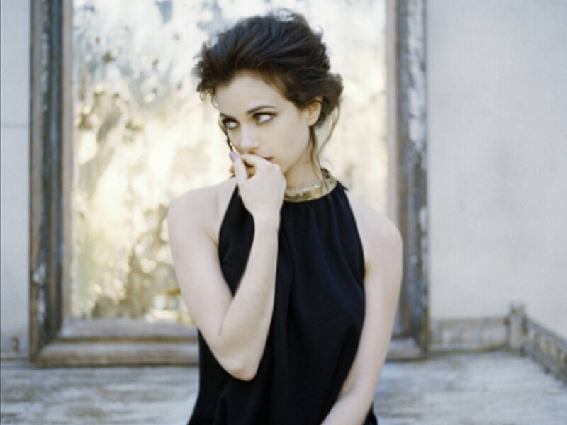 woman in black dress posing