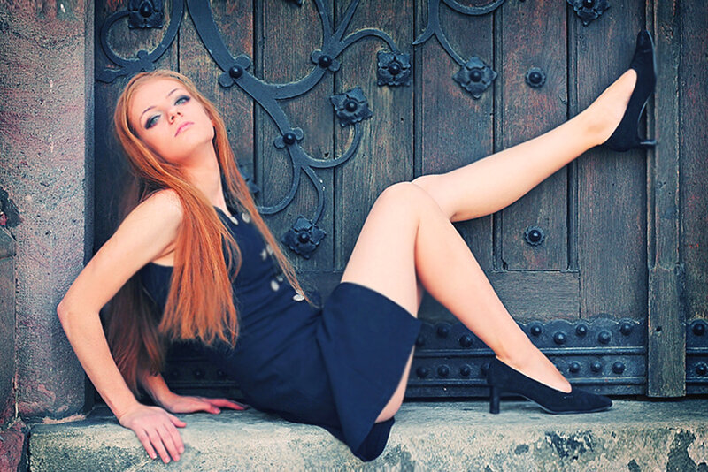 woman in black dress posing