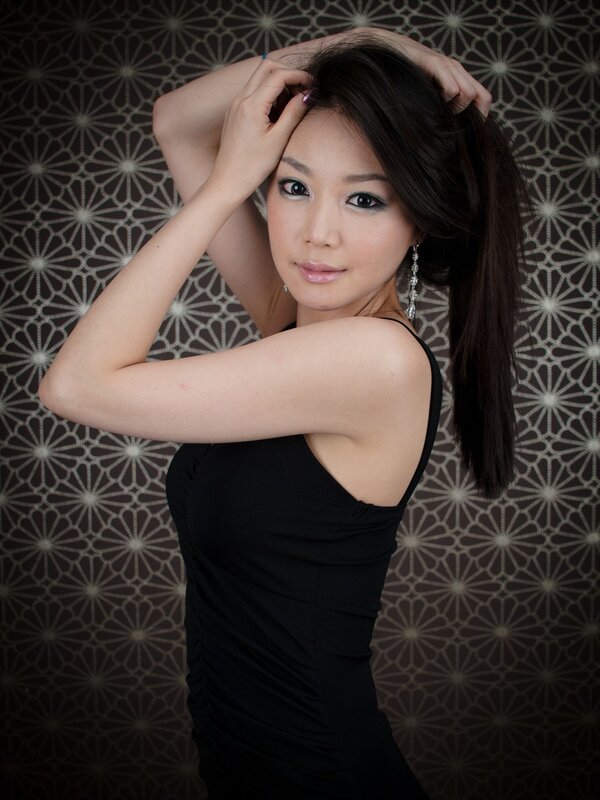 woman in black dress posing
