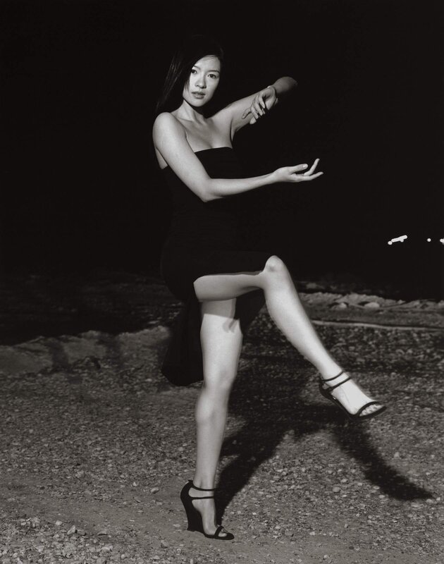woman in black dress posing
