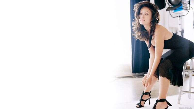 woman in black dress posing