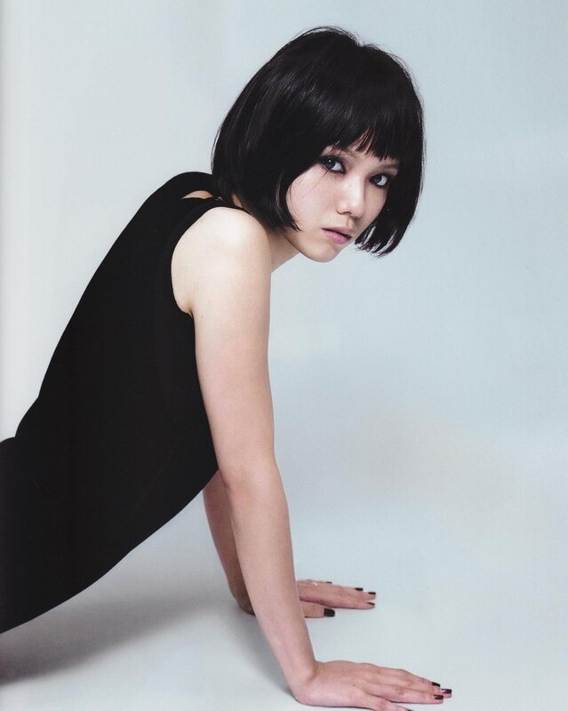 woman in black dress posing