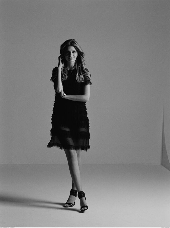 woman in black dress posing