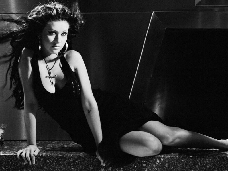 woman in black dress posing