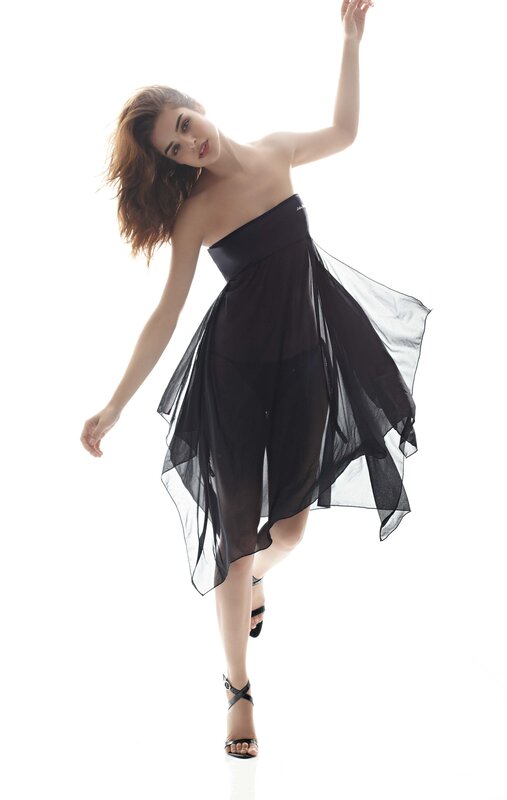 woman in black dress posing