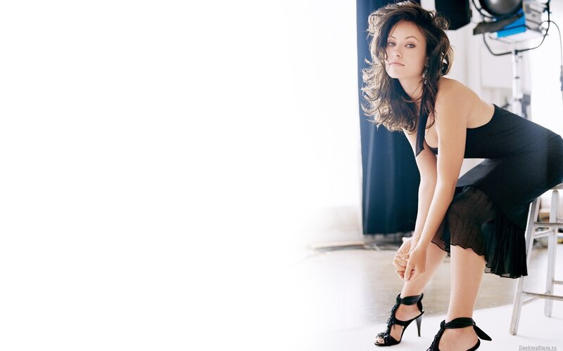 woman in black dress posing