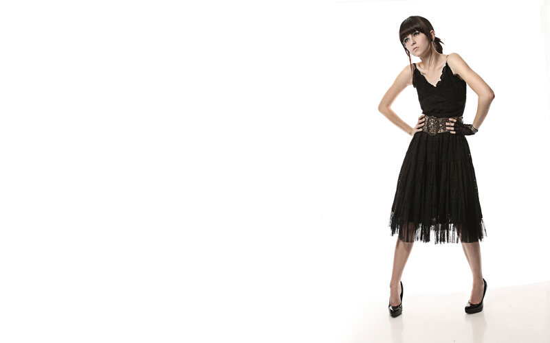 woman in black dress posing