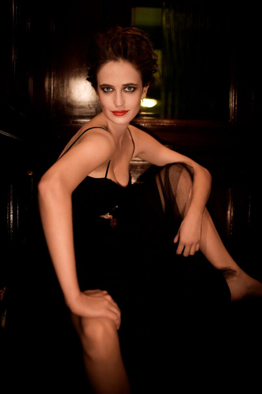 woman in black dress posing